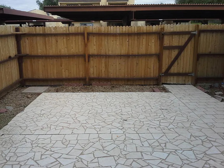 large private fenced in patio area off kitchen