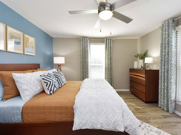 Bedroom with hardwood-style flooring