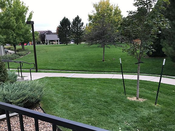 Can your view from your front door and patio get any better than this lush lawn? You don't even have to mow it!