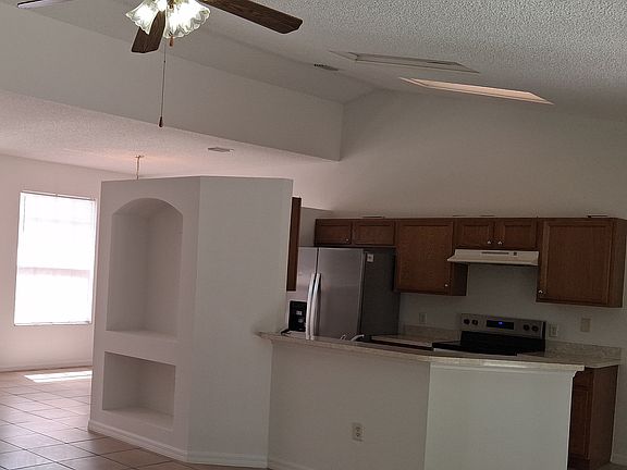 Kitchen bar space and new stainless-steel appliances