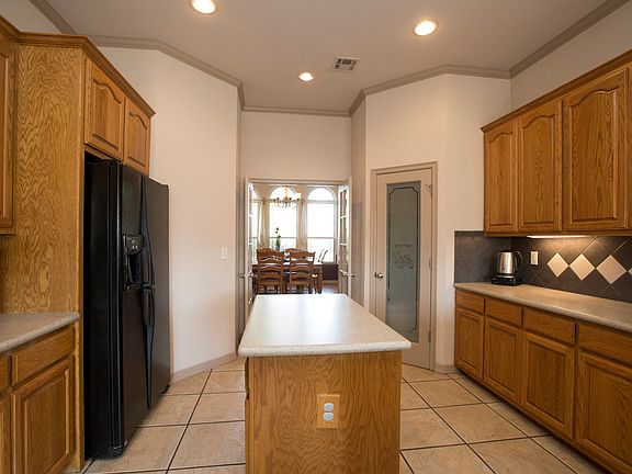 Kitchen boasts built in microwave and gas range.