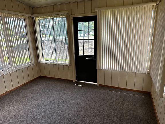 sunroom with slider windows and screens