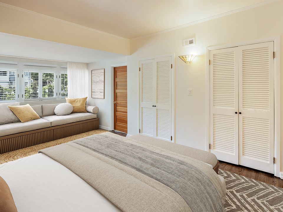 Bedroom with lots of natural light looks out to back yard and a historic neighborhood. Unit comes unfurnished