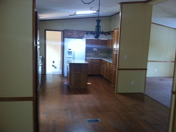 Kitchen with island, stove/oven,refrigerator, sky light