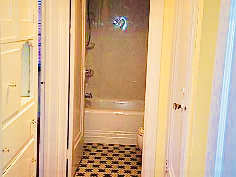 Bathroom -newly refinished shower/tub surround, original 1928 Italian tiles on floor
