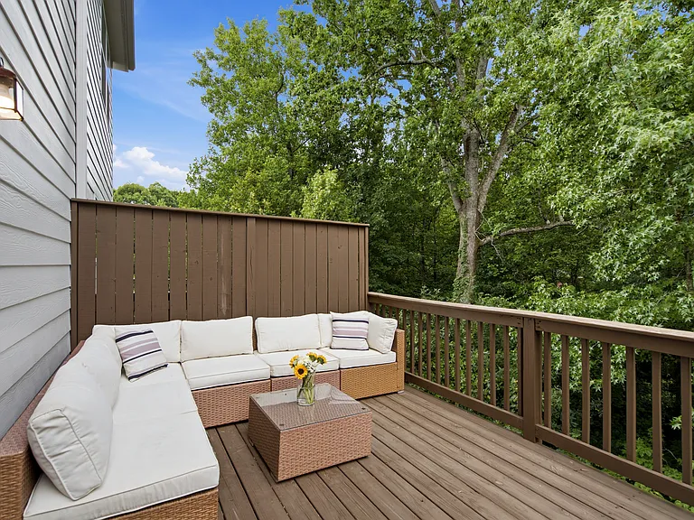 Outdoor patio with a view facing lush greenery (a rare find in the community!)