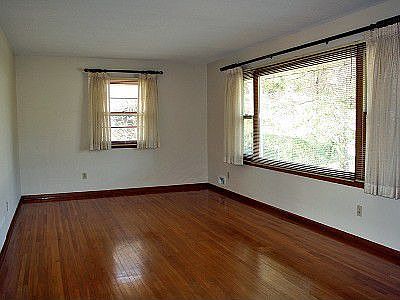 Living room.  Note the abundance of natural light and the hardwood floors!