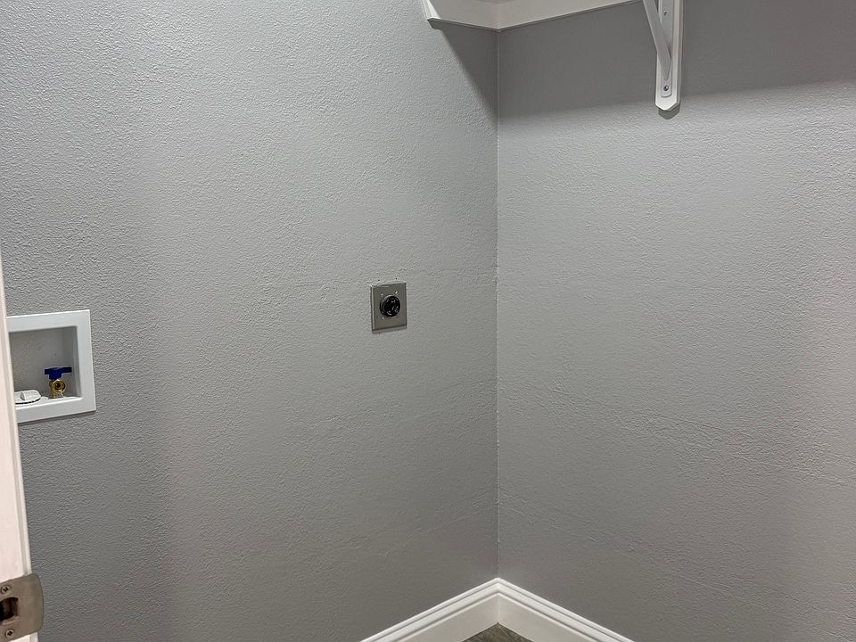Laundry Room with new water and electric connection.