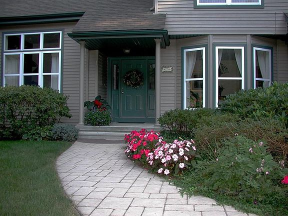 Covered front entry graces the front of 25 Kenwood....