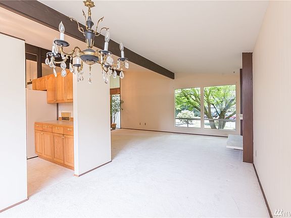 From the dining room, looking into the living room and kitchen.
