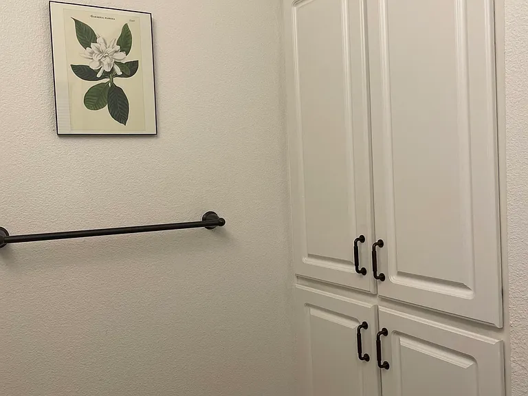 Main bathroom storage cupboards in addition to storage under each sink.