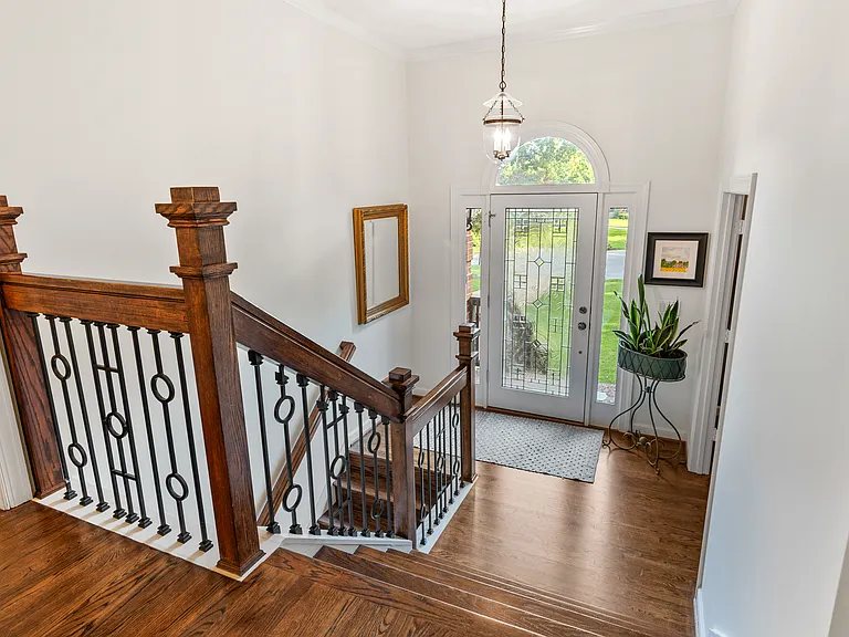 Foyer entry way. The office is through the French doors on the entryway landing, and the main living / kitchen / dining spaces are at the top of the stairs.