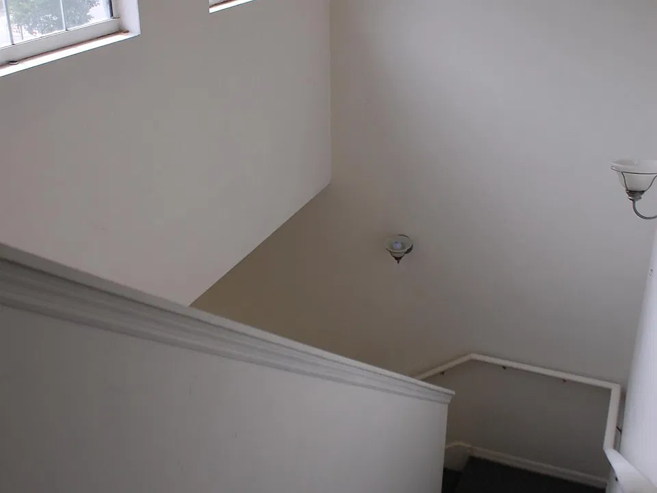 Stairwell to upstairs bedrooms and 2 baths. Lots of light in this house.