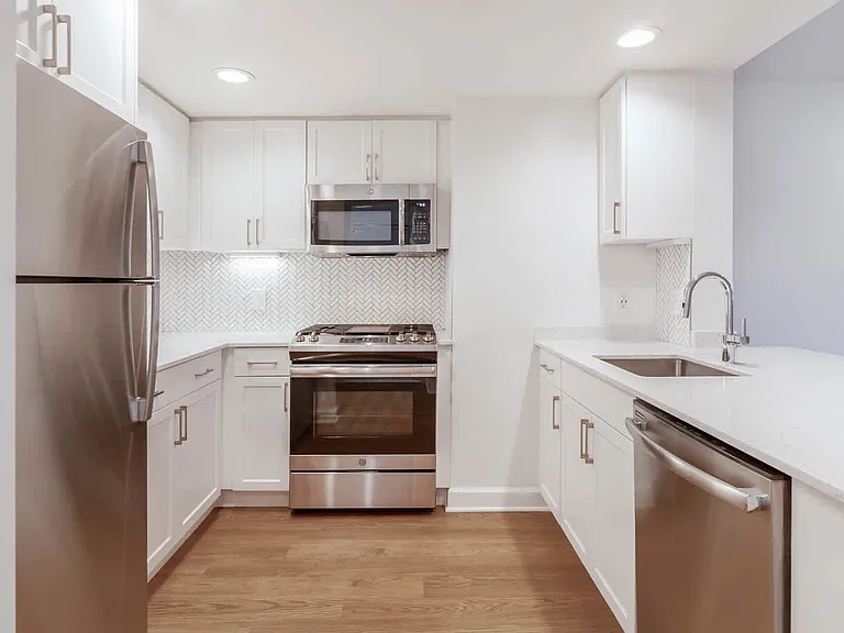 Kitchen with Quartz Countertops and Stainless Steel Appliances