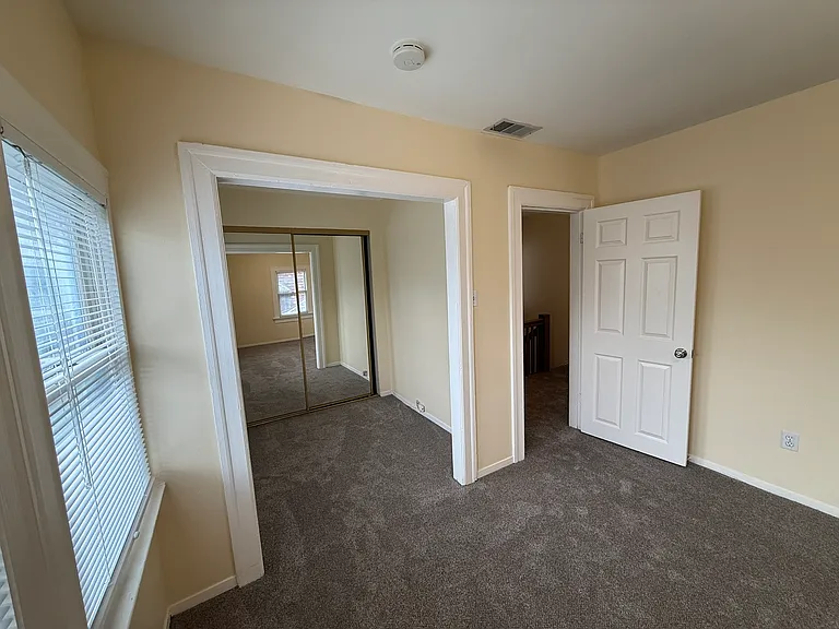 Southeast bedroom dressing area, closet with mirrored doors