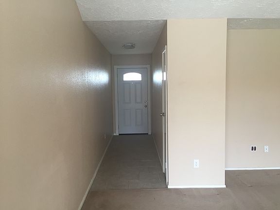 View of the front door from the spacious living room