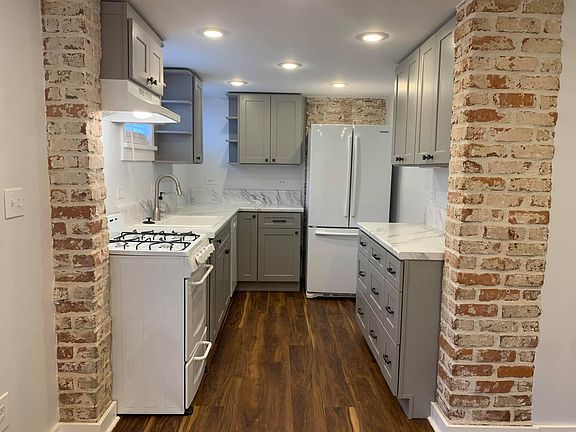 Brand new, renovated kitchen with exposed brick detailing