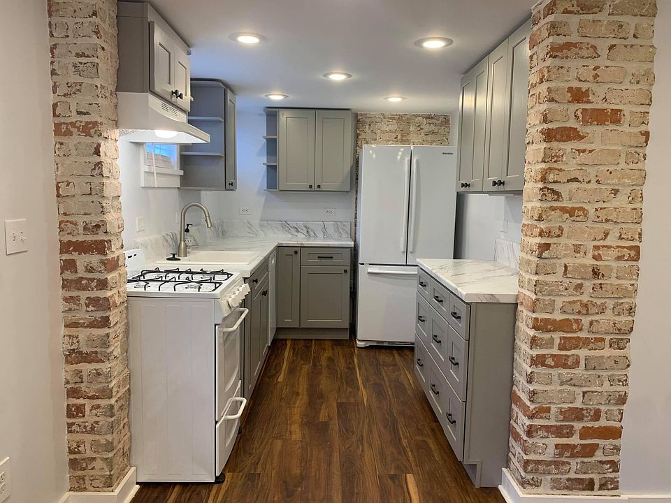 Brand new, renovated kitchen with exposed brick detailing