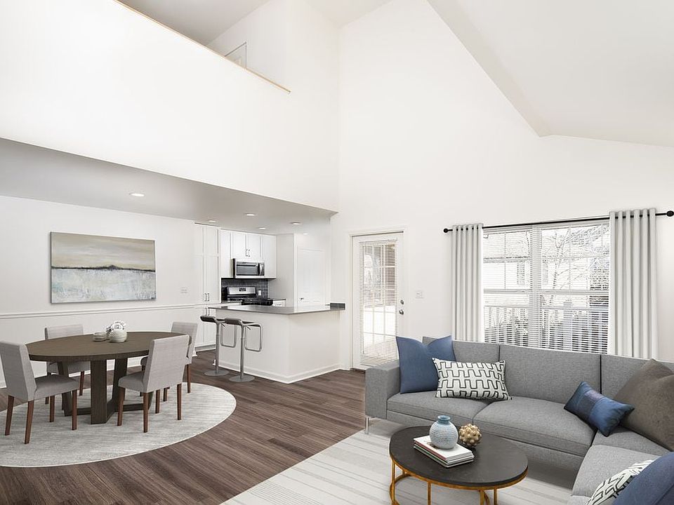 Kitchen, living, and dining areas with hard-surface flooring