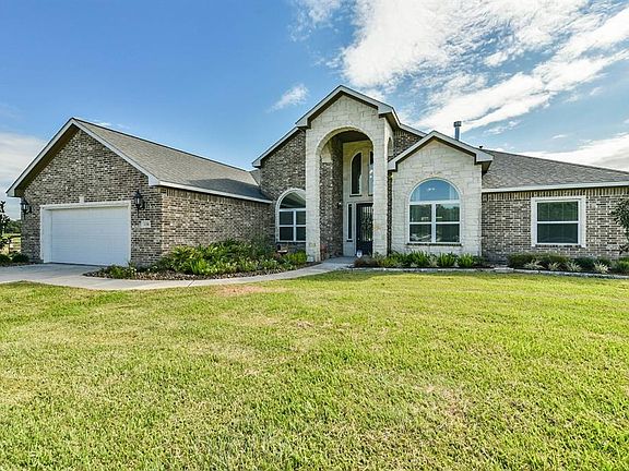 The stone and brick facade give a classy elegance to the exterior on this home.