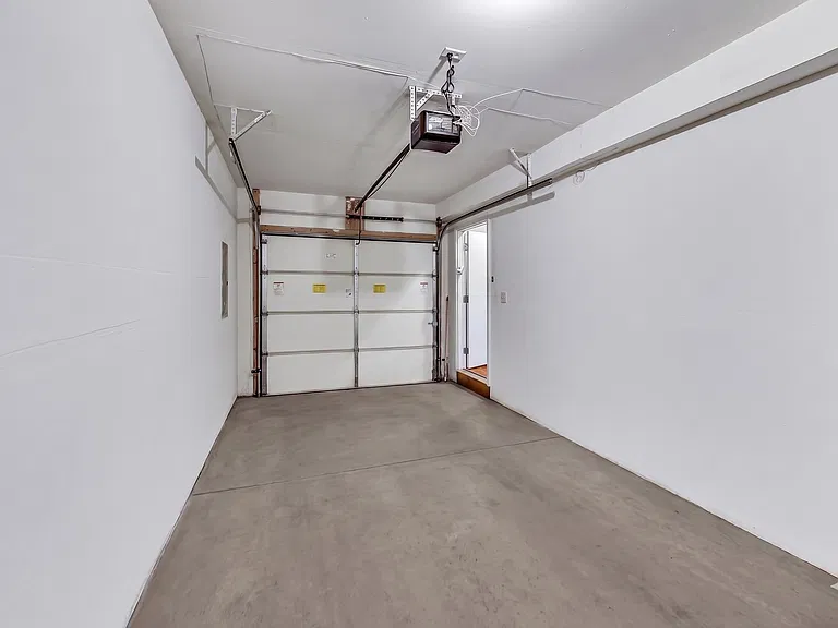 Private 1-Car Attached Garage | Direct Interior Access from Unit | with additional storage space