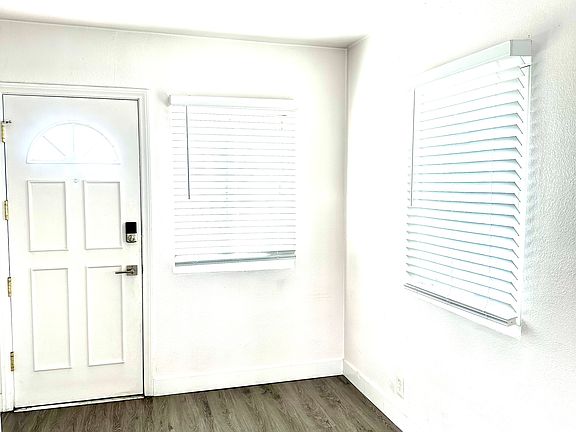 Kitchen area also has a back door that leads to a passage way to garage on side of building