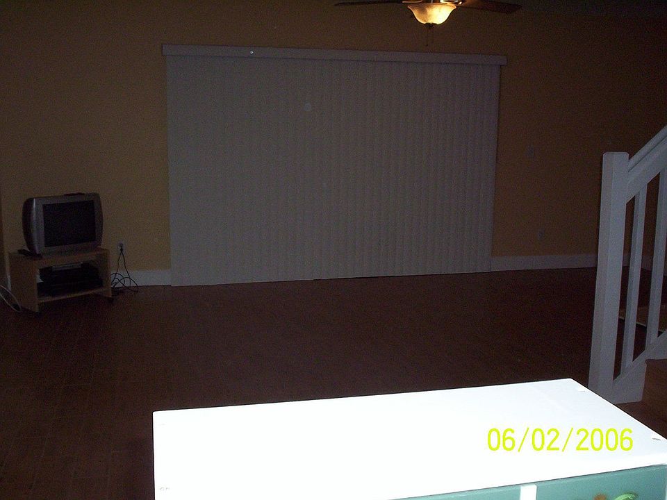 View from the kitchen area - screened porch is behind vertical blinds