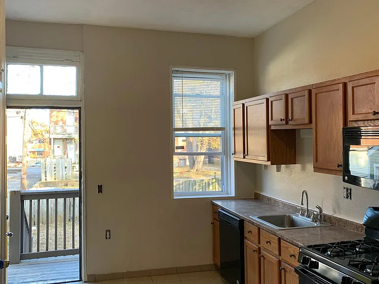 Kitchen with new appliances. Trim painting in progress