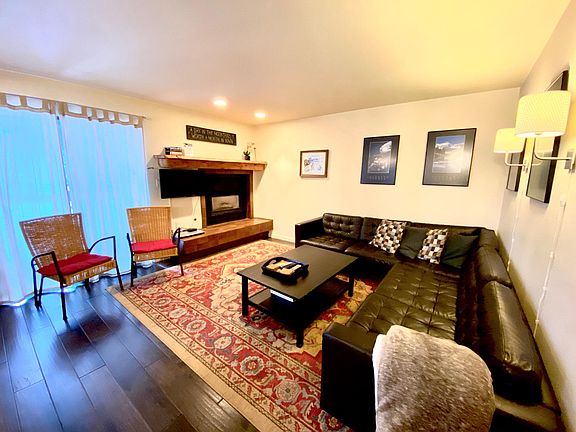 Upstairs living room with fireplace and TV