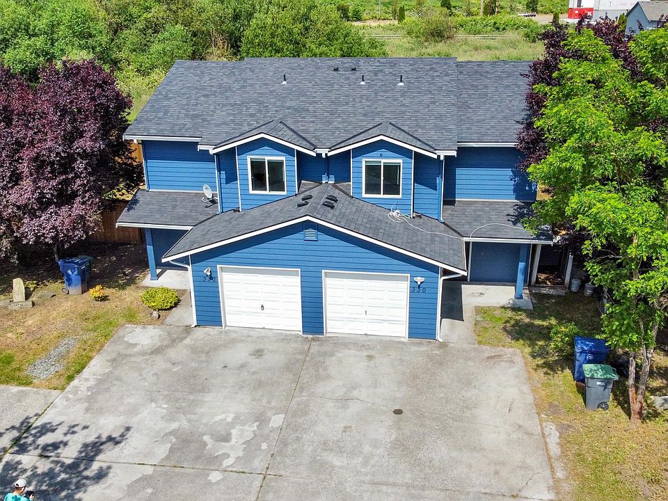Freshly updated duplex inside out - newly painted siding, new roof!
