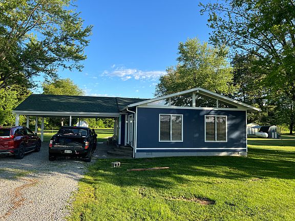 Front view including carport