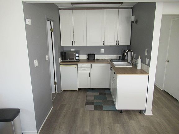 Kitchen with microwave.