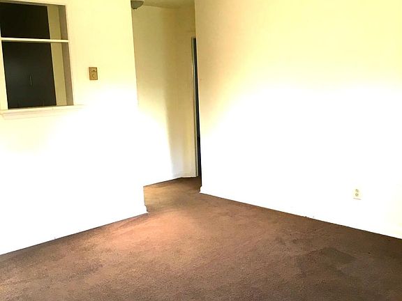 LIVING ROOM, CUT OUT TO KITCHEN