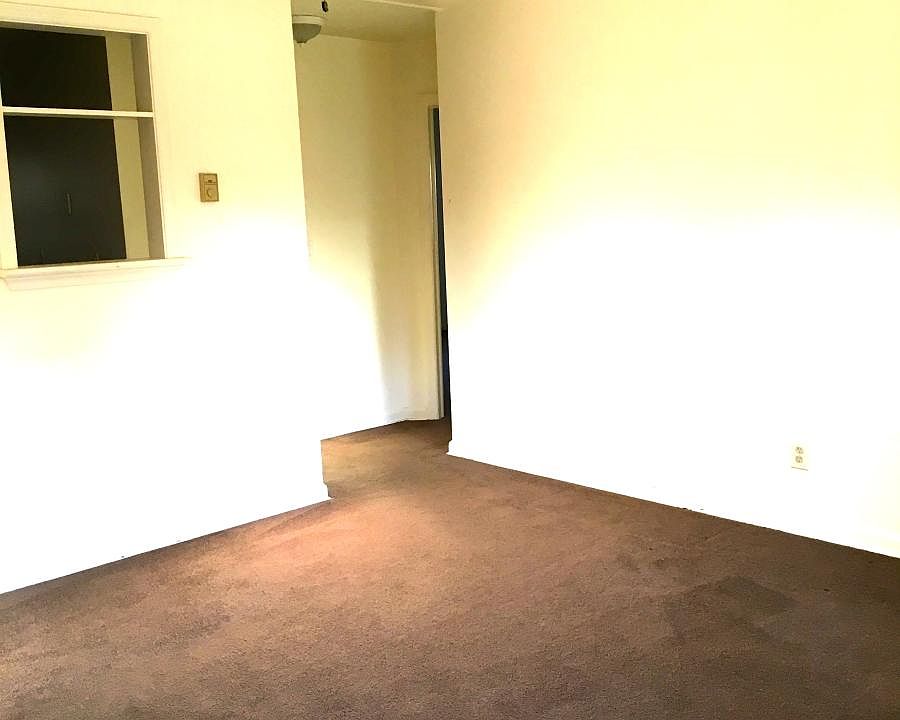 LIVING ROOM, CUT OUT TO KITCHEN