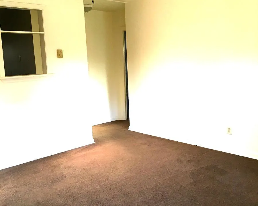 LIVING ROOM, CUT OUT TO KITCHEN