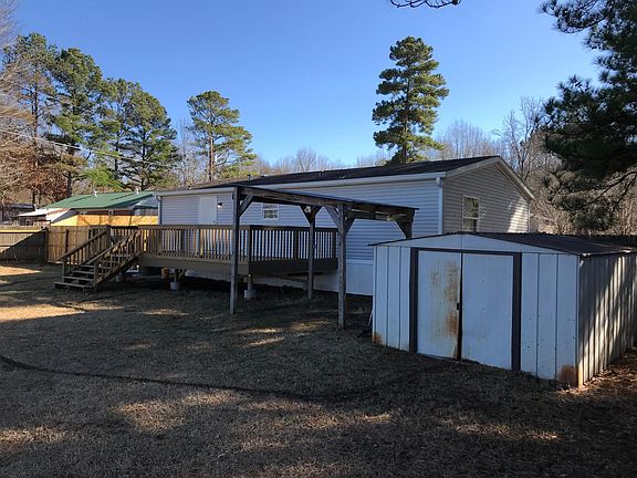 Huge 12 x 24' deck, covered area for sand box or ? Shed for storage of outdoor items in backyard.