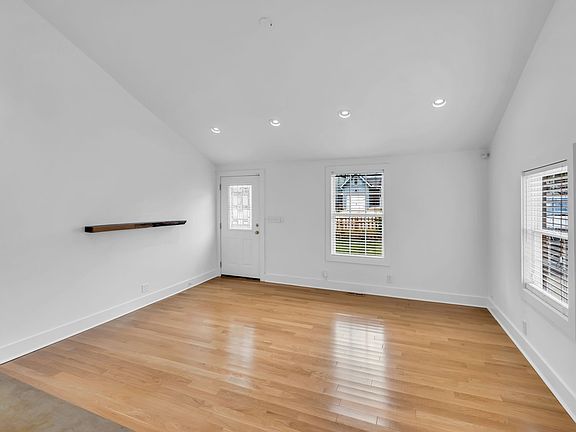 Entry + living area suitable for a dining space and/ or living room