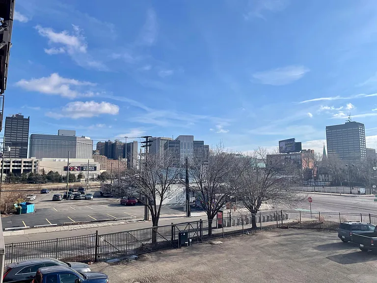 Private outdoor balcony w/ downtown views and outdoor gated parking Lot for you and your guests