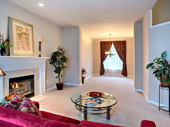 Fireplace mantel with marble tile and marble floor. The gas ceramic log with embers is the most realistic looking gas fireplace and also comes with a fan.