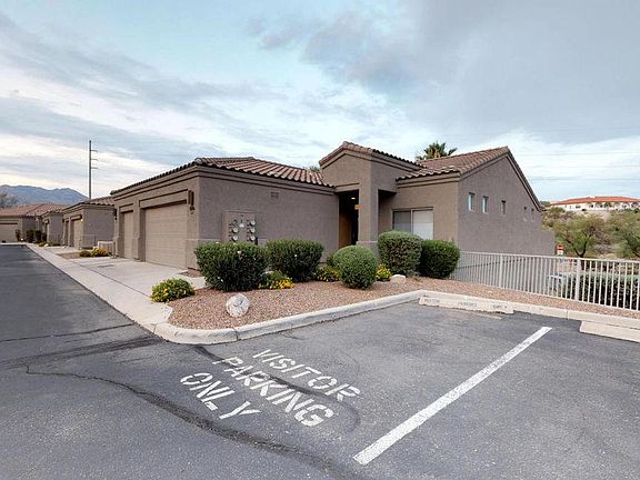 next to visitor parking