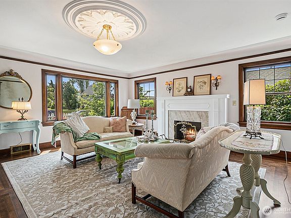 Refinished Wood Burning Fireplace & Beautiful Wood Wrapped Windows>