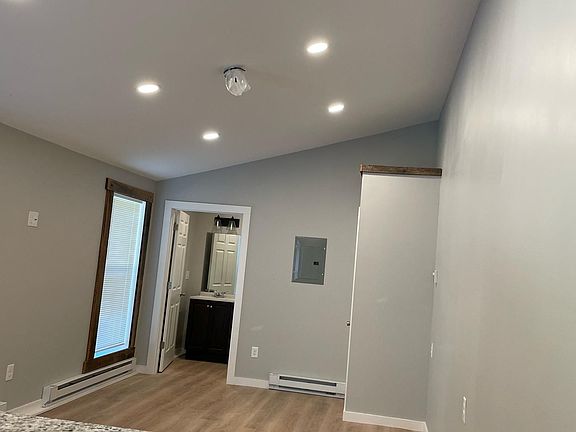 Many possibilities, a room divider would close off for privacy and still room for a sofa. Or, A sleep sofa with additional chairs to fold away your bed.