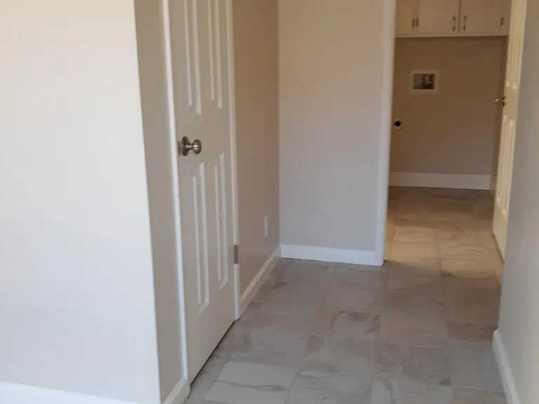 Entry way looking into laundry room/kitchen.
