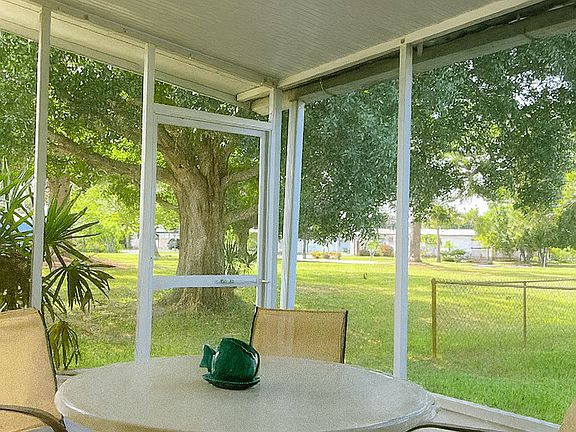 Back porch opens up to a beautiful greenspace.