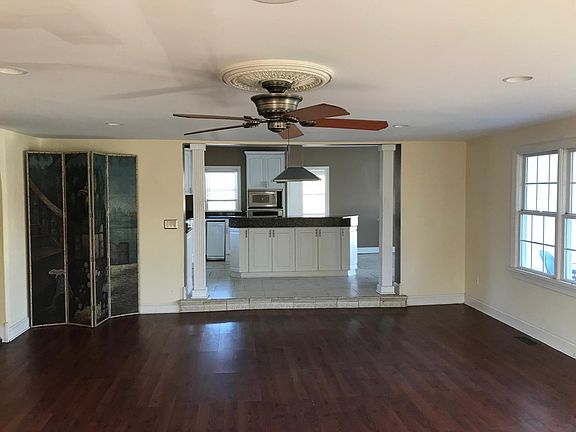 Open Concept Family Room Adjoining Kitchen and Rear Deck
