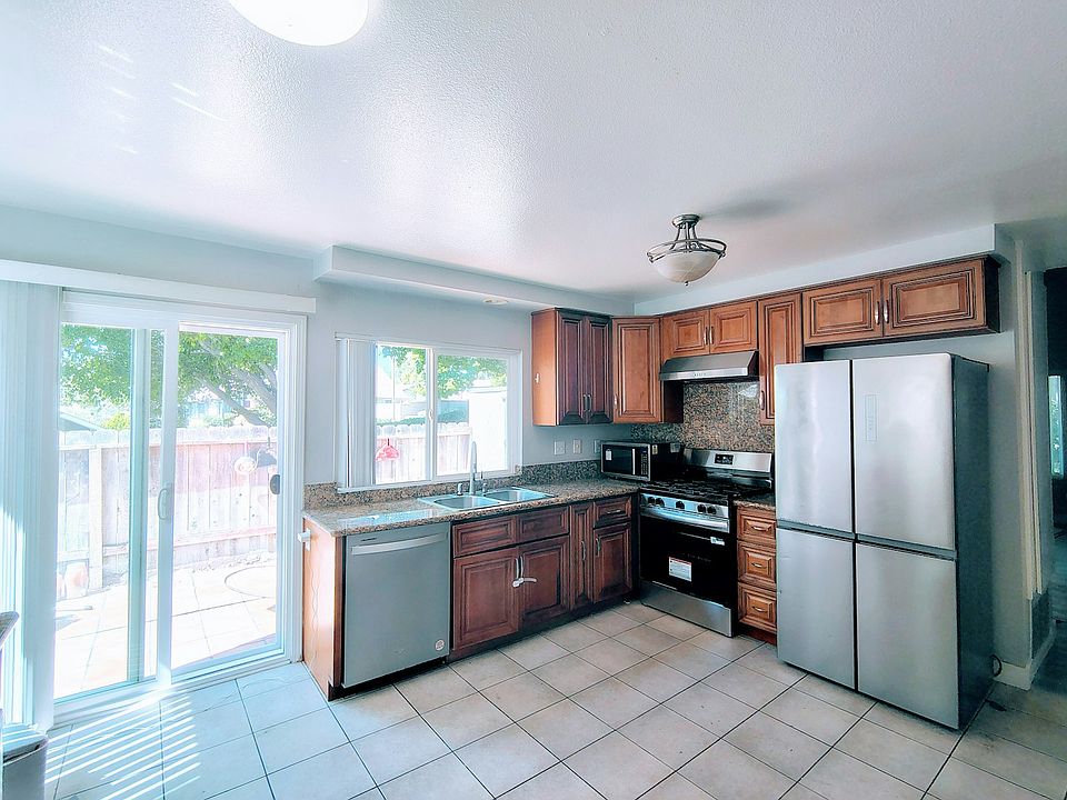 Kitchen equipped with all stainless steel appliances and hookups for reverse osmosis water filtration