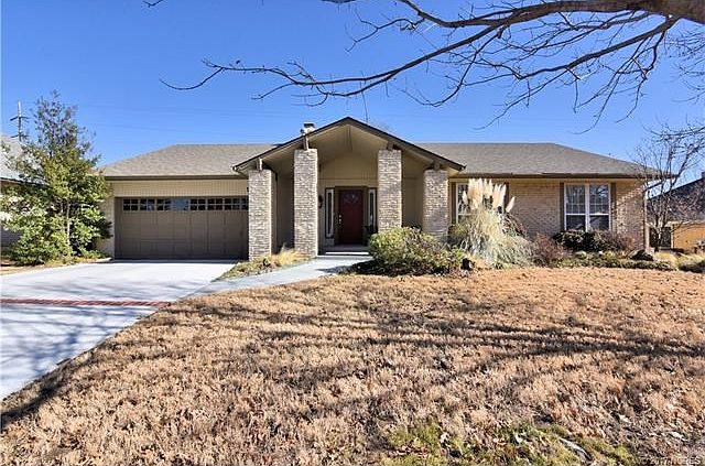 Home faces West, back to East, new driveway, covered front porch. Professionally landscaped w/up lighting.