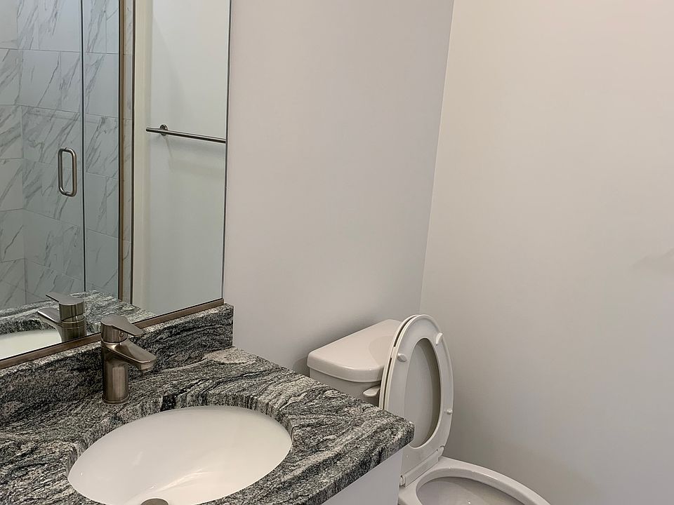 Main bathroom attached to bedroom. In addition, there is a powder room in the main area.