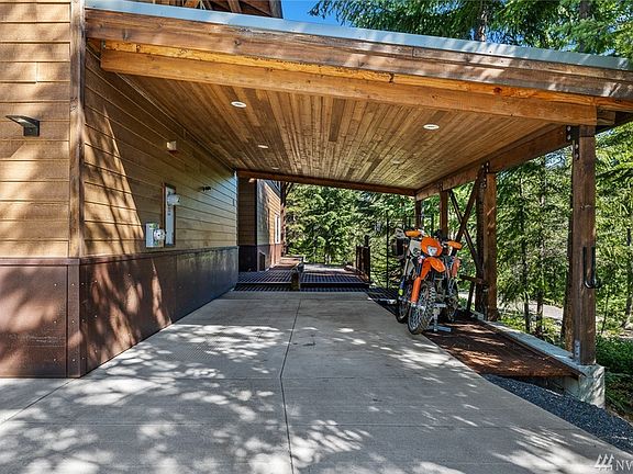 This carport has a beautiful ceiling soffit with lighting. Large enough to put 2 vehicles under cover or as many toys as you chose. 
