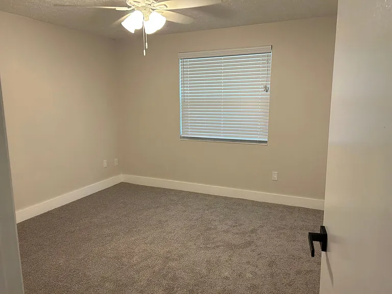 Bedroom #1 with large closet, brand new carpet, brand new fan, brand new blind and brand new energy efficient window.